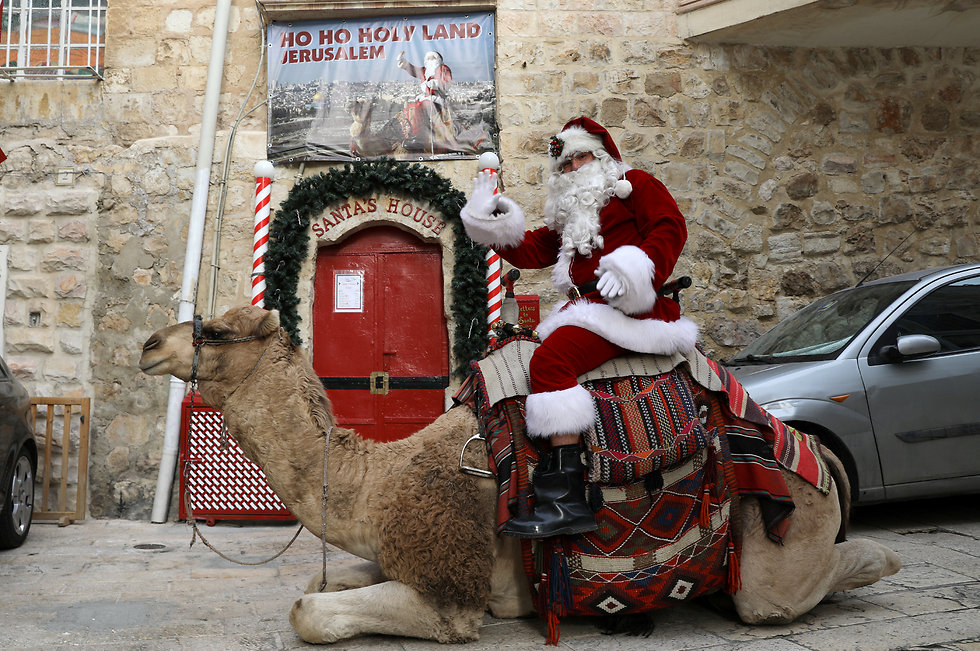 Santa Claus in Jerusalem on a camel