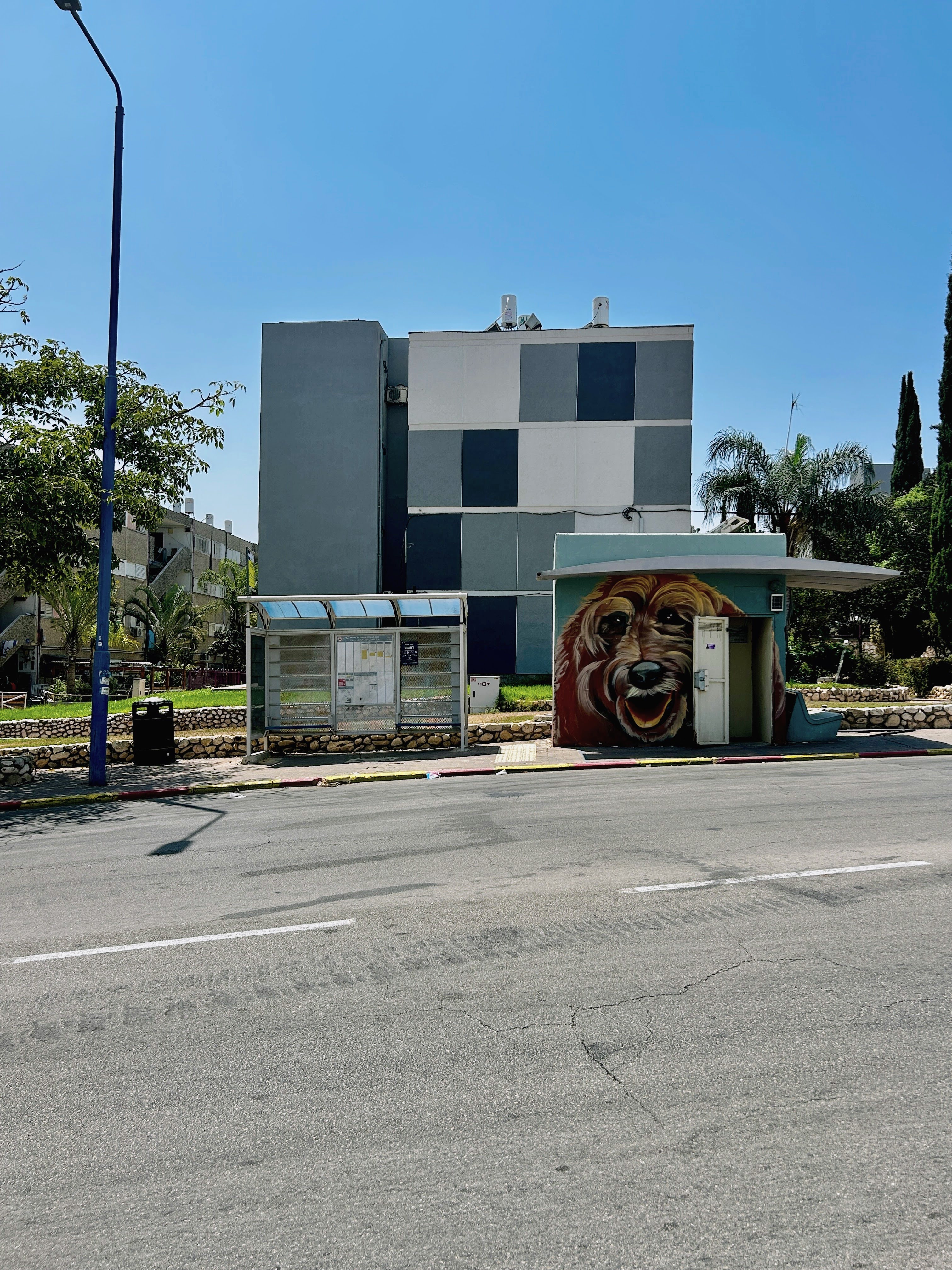 Portable bomb shelter (_megunit_) next to the bus stop - a common sight in the city of Sderot