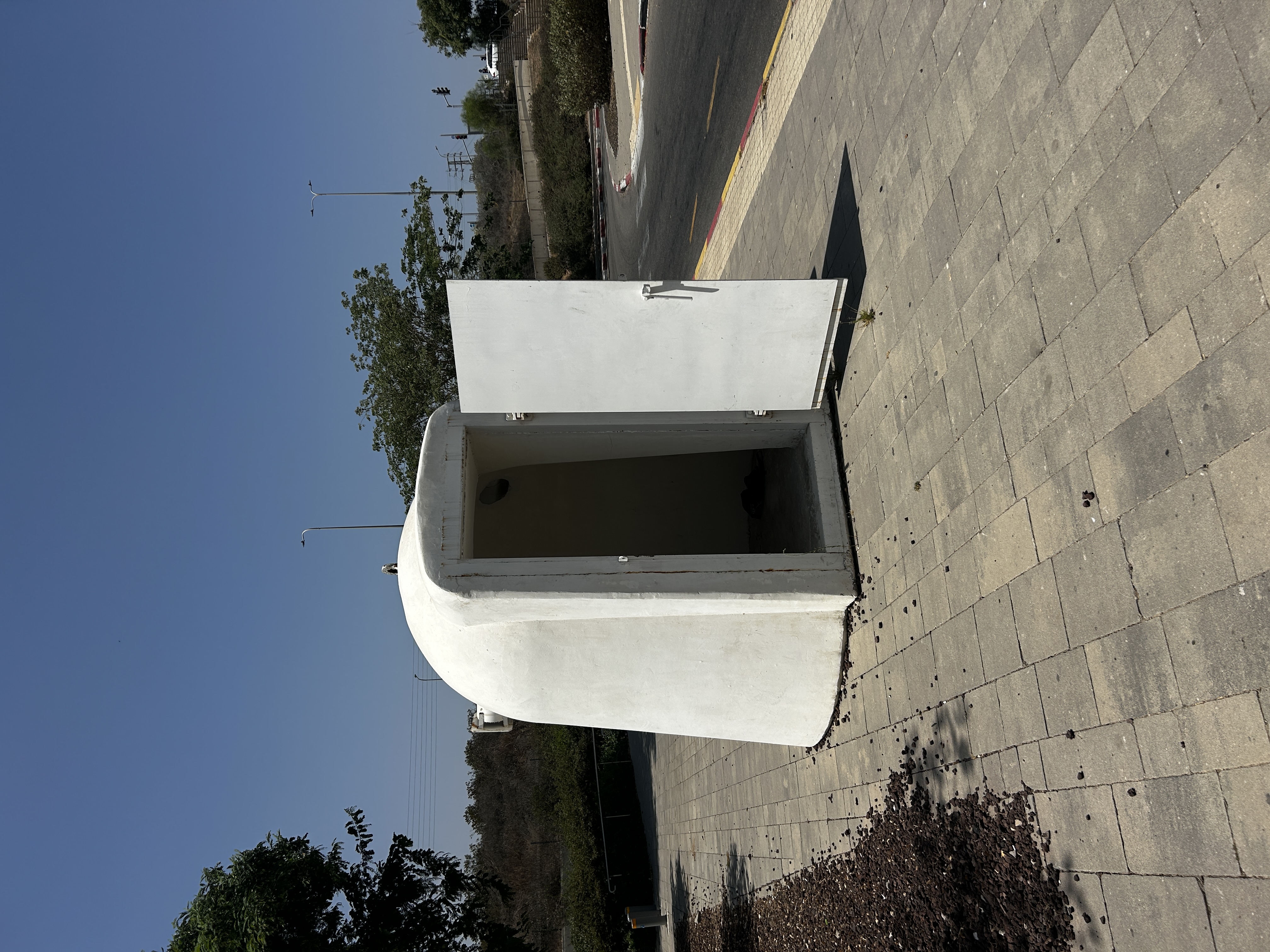 Quite adorable bomb shelter next to the bus stop.